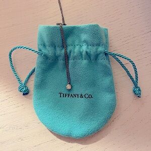 0.12 Carat Tiffany Solitaire Diamond Pendant in Platinum